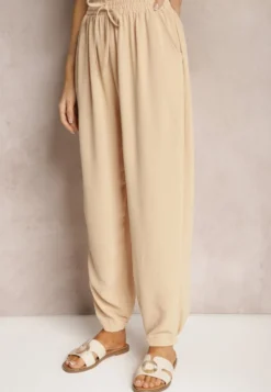 Beżowe Casualowe Spodnie High Waist Wykończone Gumką w Pasie Dimrue