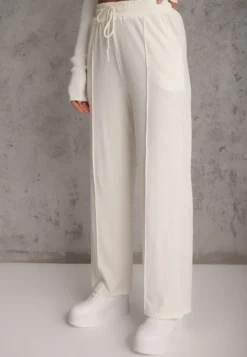 Jasnobeżowe Prążkowane Spodnie High Waist z Szerokimi Nogawkami Ginorria