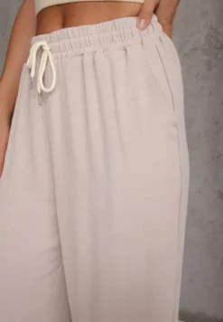 Jasnobeżowe Spodnie High Waist ze Sznurkiem w Talii i Prostą Nogawką Raveann