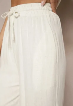 Jasnobeżowe Spodnie Palazzo o Szerokim Kroju High Waist Ozdobione Wiązaniem Sonariella